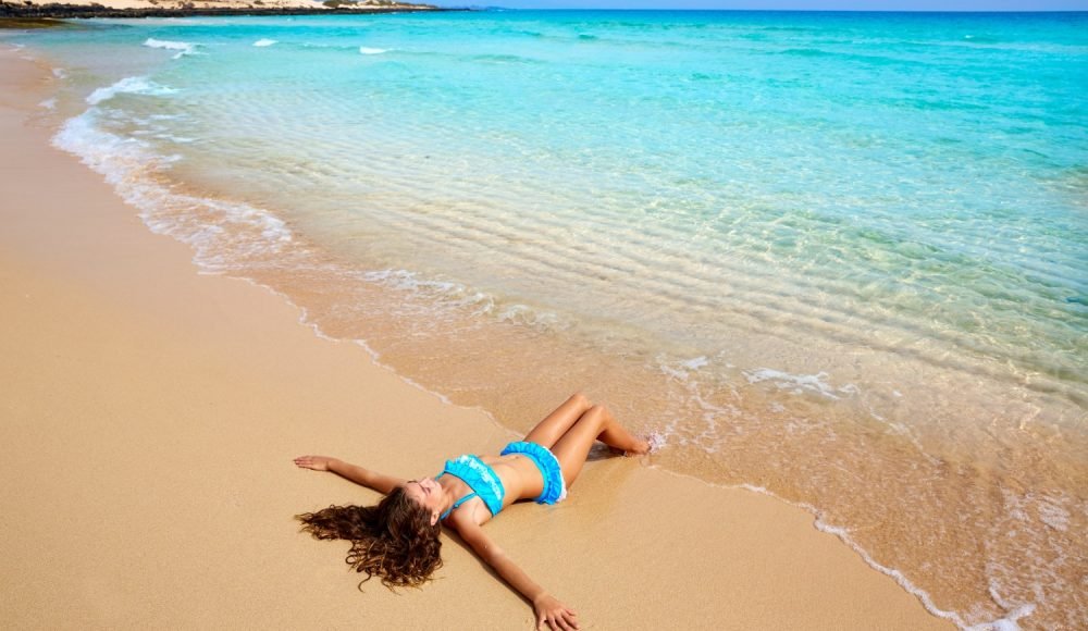 Girl on the beach Fuerteventura at Canary Islands of Spain